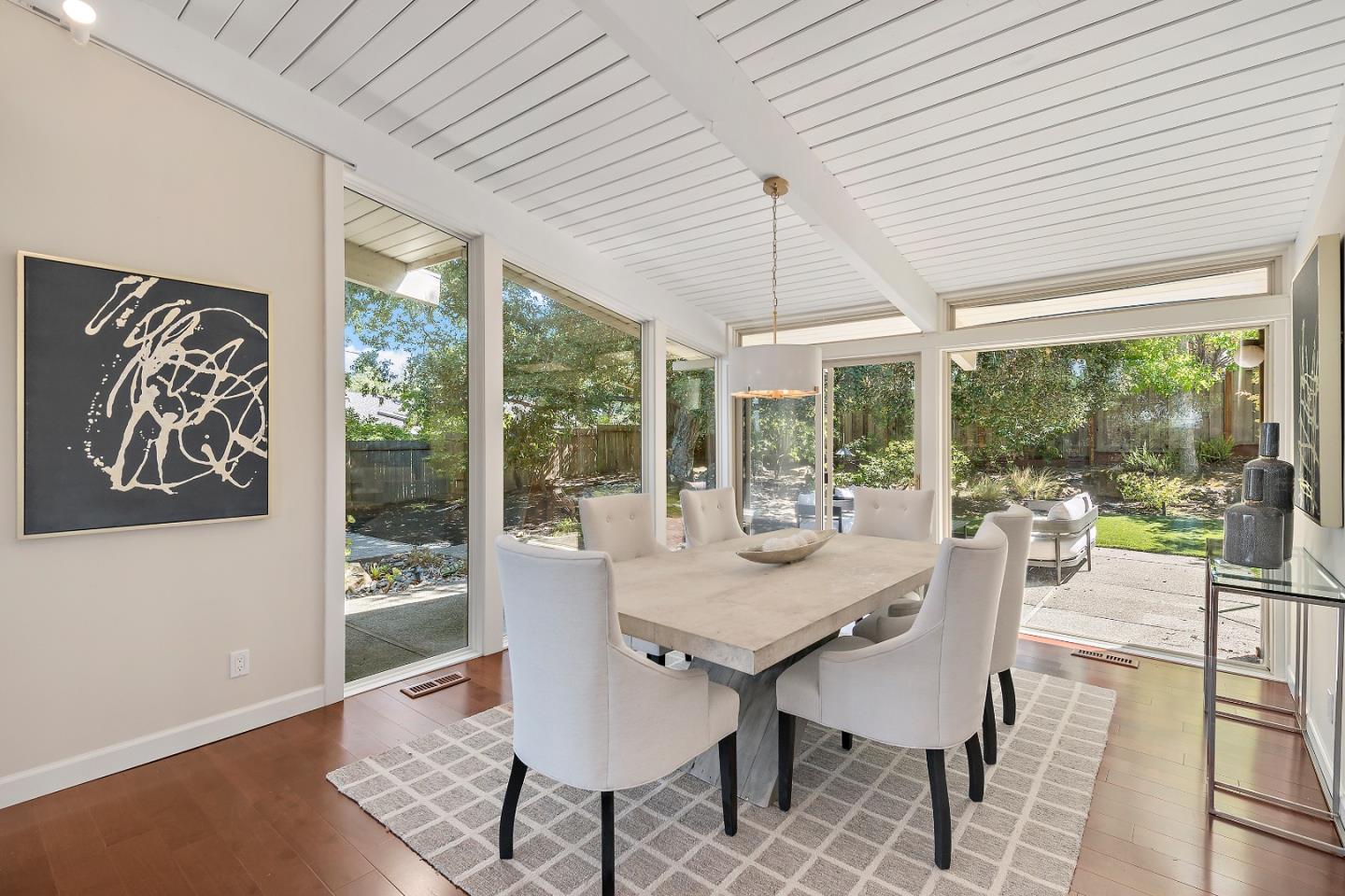 60 Linaria Way Portola Valley, CA 94028 - Photo 9 of 39 a view of a dining room with furniture large windows and wooden floor