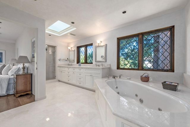 a bathroom with a bathtub and a sink