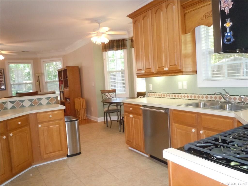 124 Zimmerman Drive Fort Mill, SC 29708 - Photo 17 of 35 a kitchen with stainless steel appliances granite countertop a sink stove and refrigerator