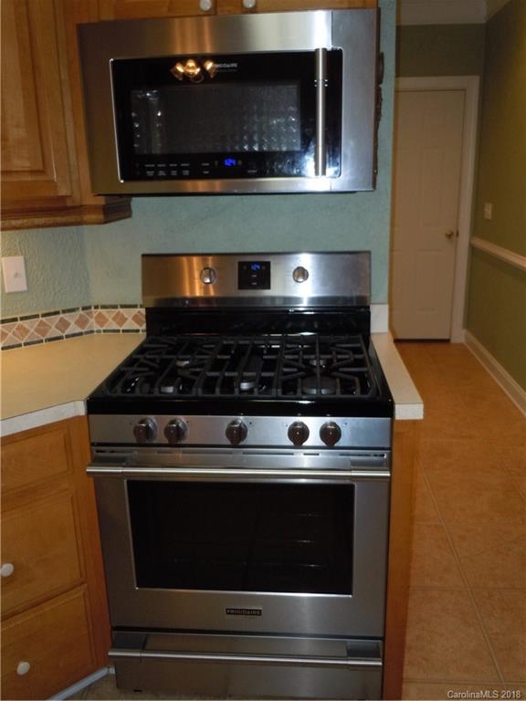 124 Zimmerman Drive Fort Mill, SC 29708 - Photo 18 of 35 a stove top oven sitting inside of a kitchen