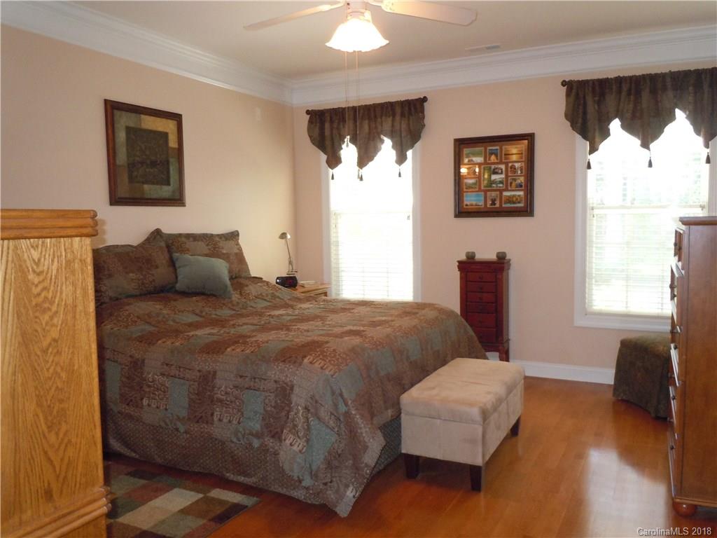 124 Zimmerman Drive Fort Mill, SC 29708 - Photo 21 of 35 a bedroom with a bed a couch and a window