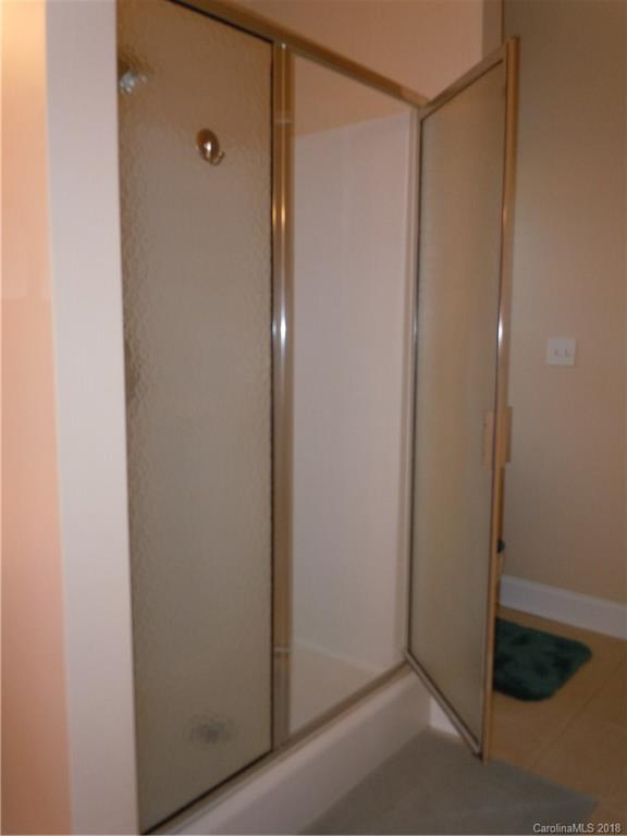 124 Zimmerman Drive Fort Mill, SC 29708 - Photo 25 of 35 a bathroom with a glass shower door