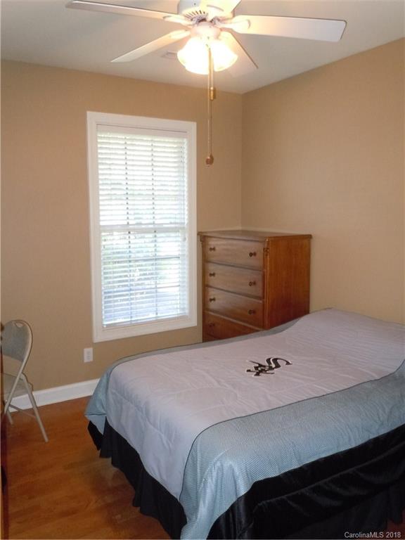 124 Zimmerman Drive Fort Mill, SC 29708 - Photo 27 of 35 a bedroom with a bed and a chandelier