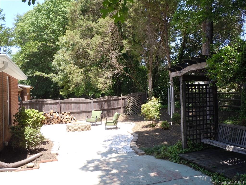 124 Zimmerman Drive Fort Mill, SC 29708 - Photo 35 of 35 a view of a patio with table and chairs potted plants and large tree