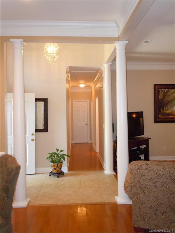 124 Zimmerman Drive Fort Mill, SC 29708 - Photo 6 of 35 a bedroom with a bed and wooden floor