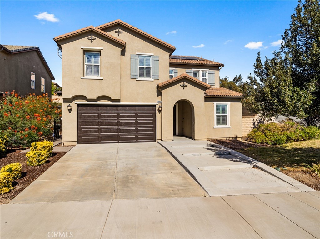 28002 Kenny Lane Saugus, CA 91350 - Photo 1 of 1 a front view of a house with a yard and garage