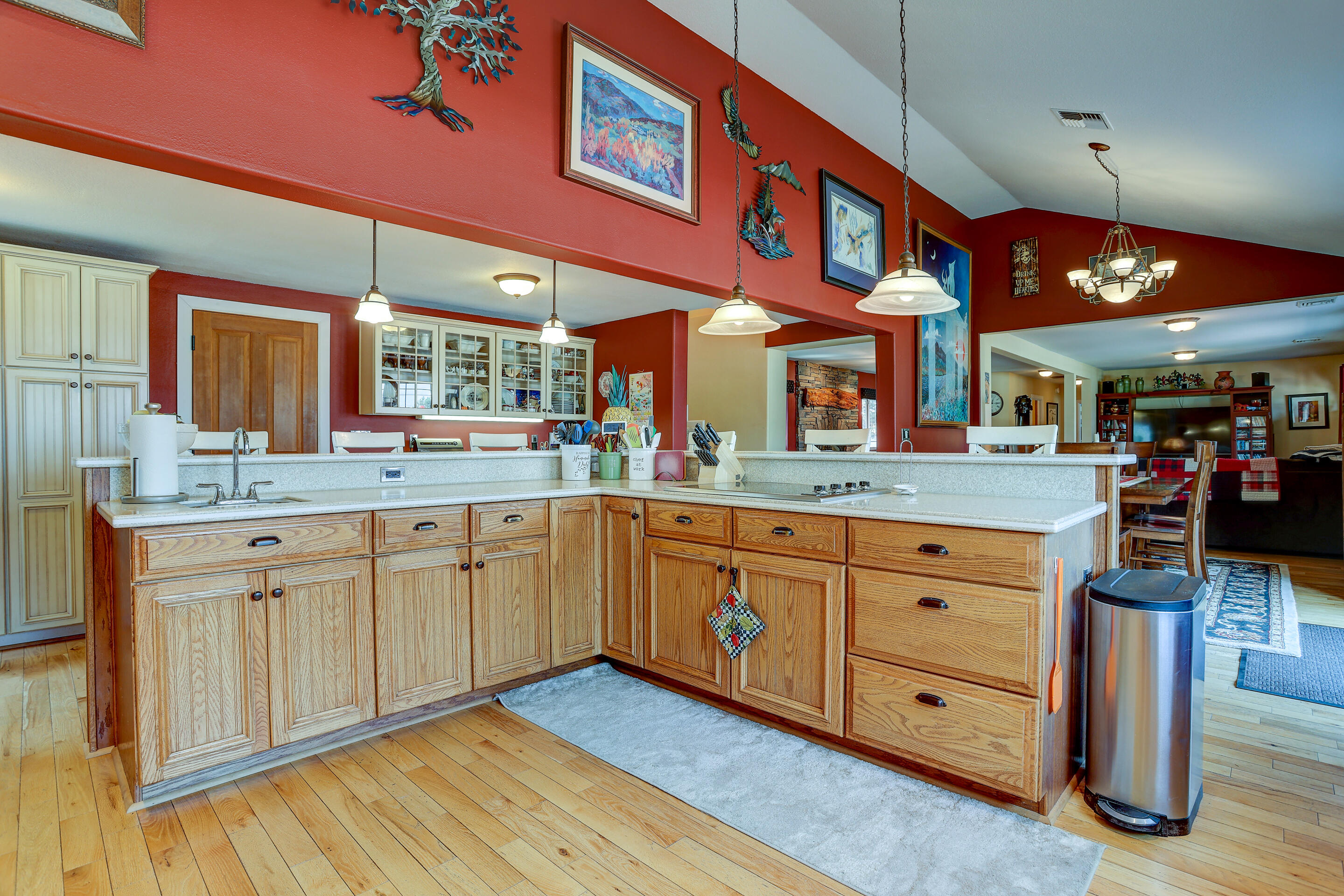 60875 Billadeau Road Bend, OR 97702 - Photo 14 of 42 a large kitchen with stainless steel appliances granite countertop a large stove a sink dishwasher and cabinets with wooden floor
