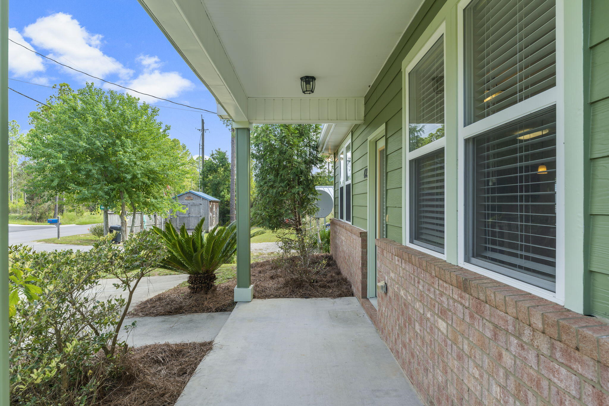 435 Indian Woman Road Santa Rosa Beach, FL 32459 - Photo 3 of 25 a view of a house with a porch