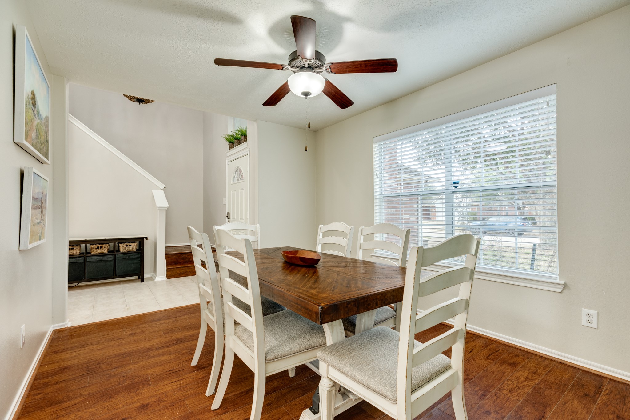 4113 Merlet Drive Pearland, TX 77584 - Photo 5 of 36 Another view showcasing the expansive dining area, highlighted by sizable windows that allow abundant natural light to flood the space.
