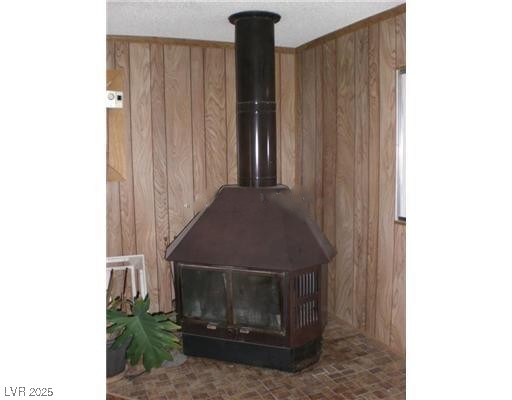 332 Huntly Road Las Vegas, NV 89145 - Photo 5 of 7 Detailed view of wood walls and a wood stove