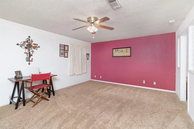 a view of a livingroom with a workspace