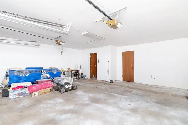 a bedroom with furniture and a chandelier