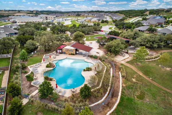 an aerial view of a house with a lake view