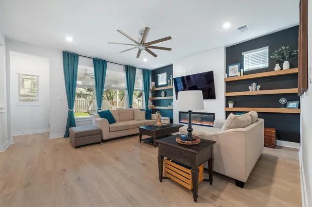 a living room with furniture and a large window