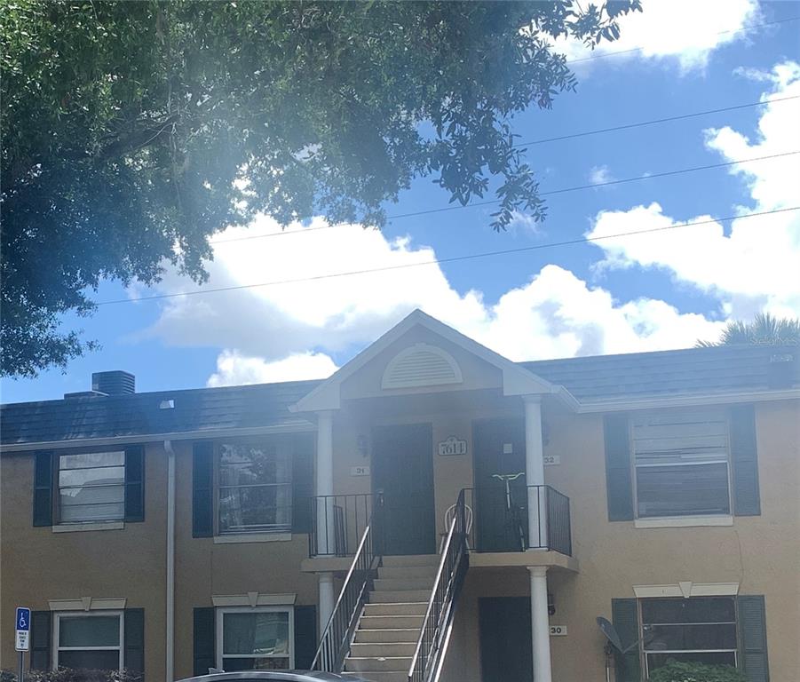 7614 Forest City Road, Unit G Orlando, FL 32810 - Photo 1 of 1 a view of a house with a yard