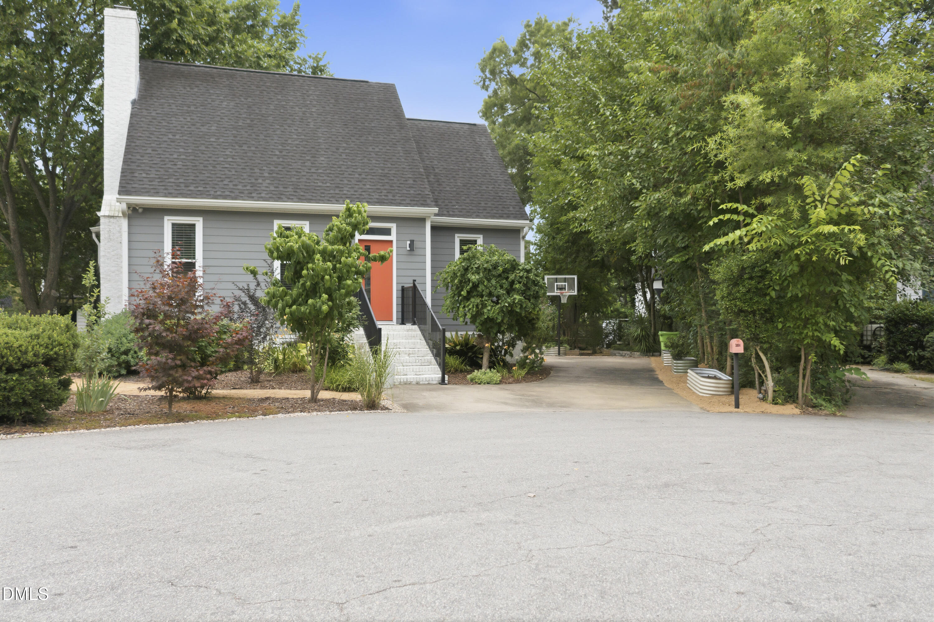 3004 West Annaley Drive Raleigh, NC 27604 - Photo 4 of 44 front view of a house with a yard and potted plants