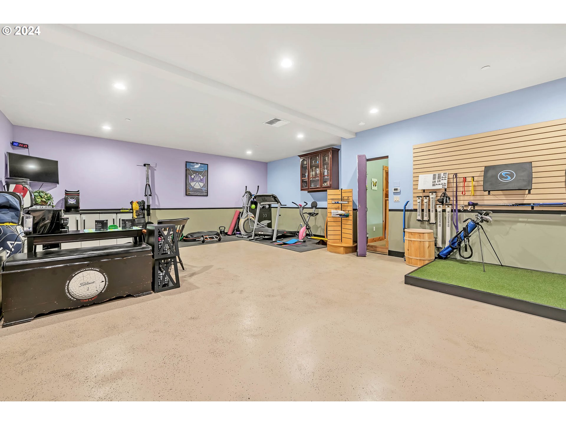 2735 Emerald Street Eugene, OR 97403 - Photo 26 of 47 a living room with furniture a flat screen tv and a refrigerator