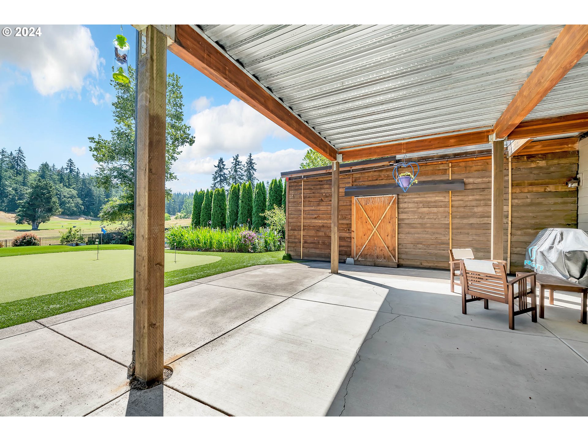 2735 Emerald Street Eugene, OR 97403 - Photo 30 of 47 a backyard of a house with a garden and entertaining space