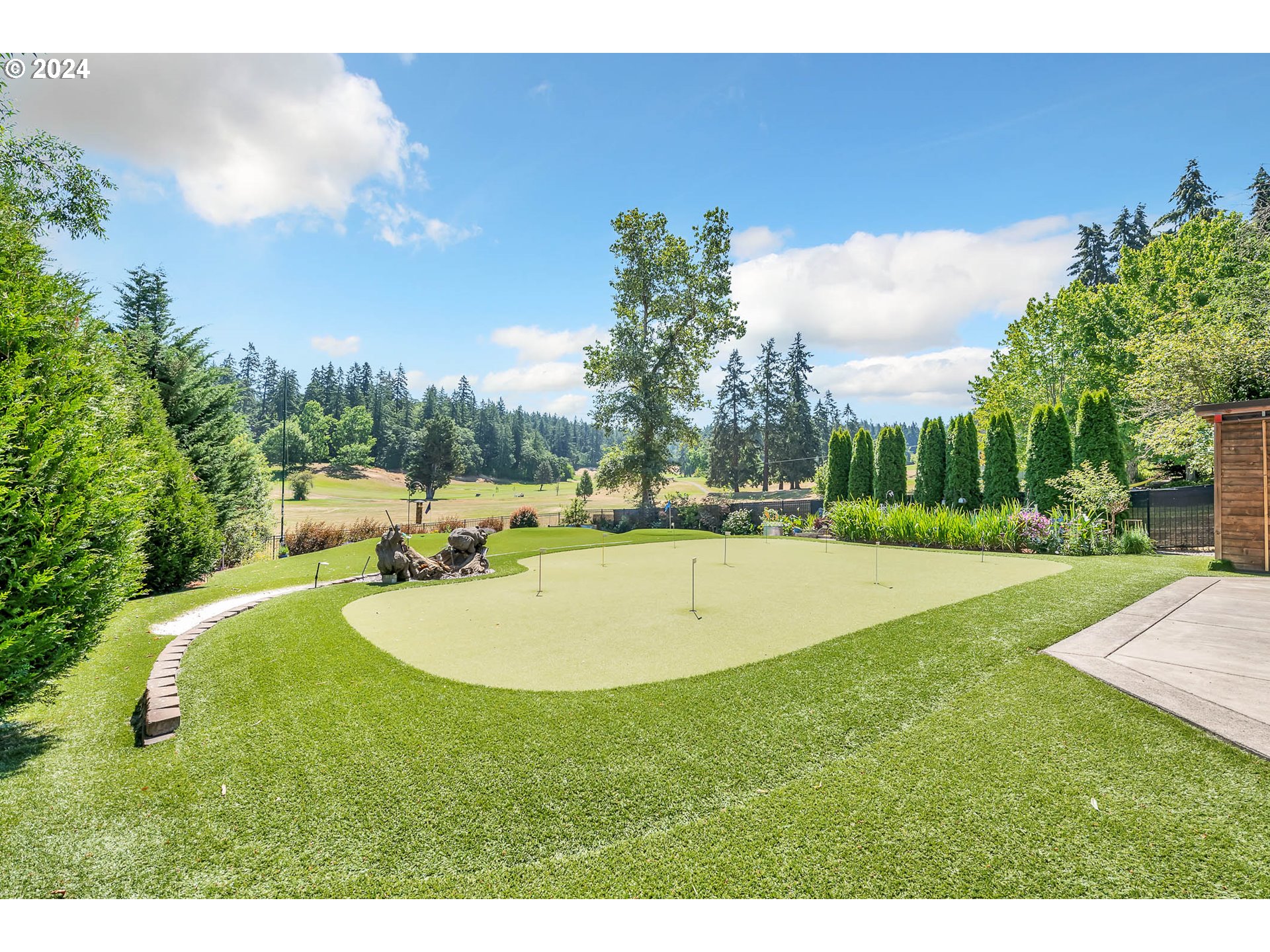 2735 Emerald Street Eugene, OR 97403 - Photo 32 of 47 a swimming pool with trees in the background