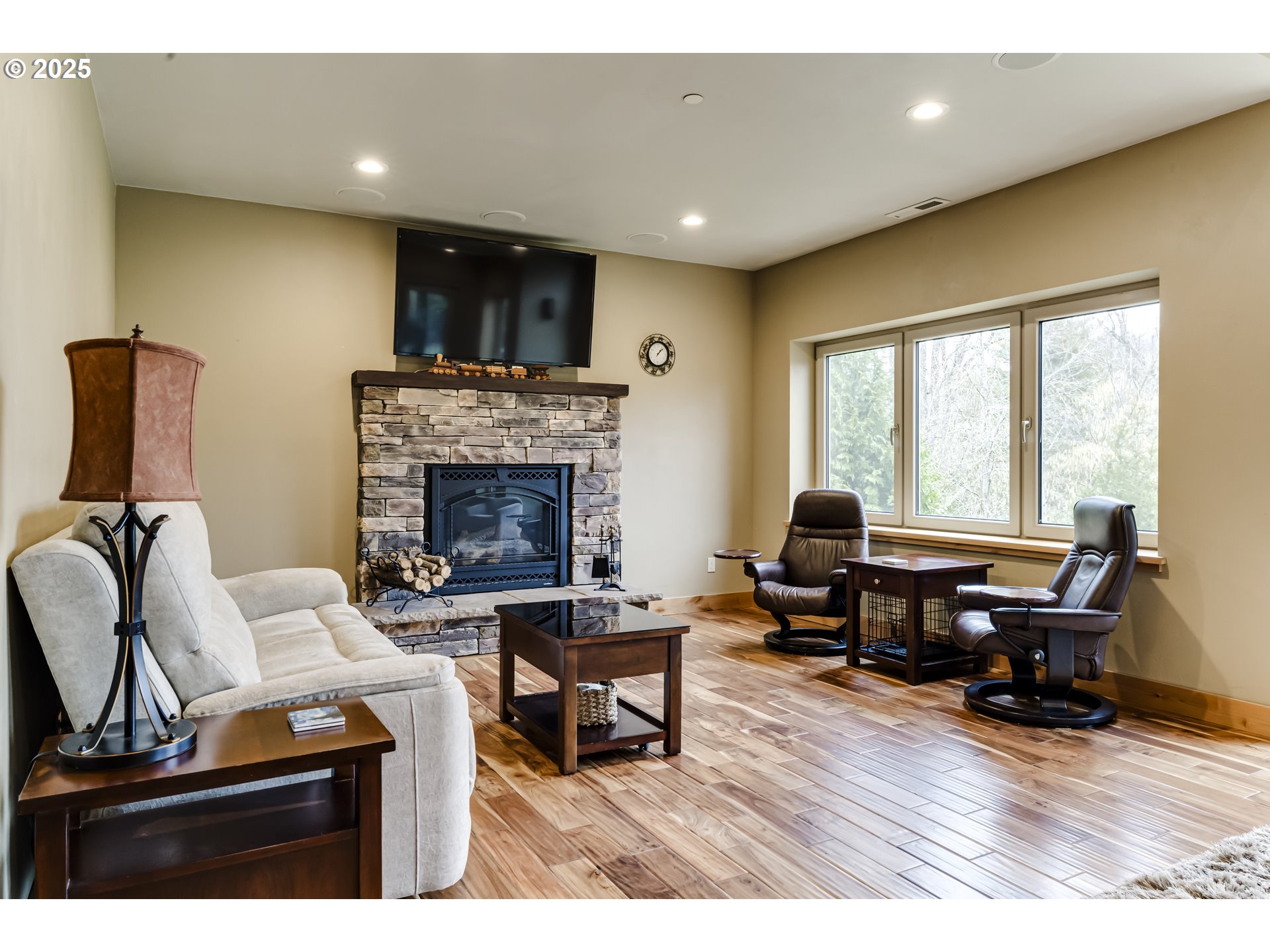 2735 Emerald Street Eugene, OR 97403 - Photo 6 of 47 a living room with furniture a piano and a fireplace