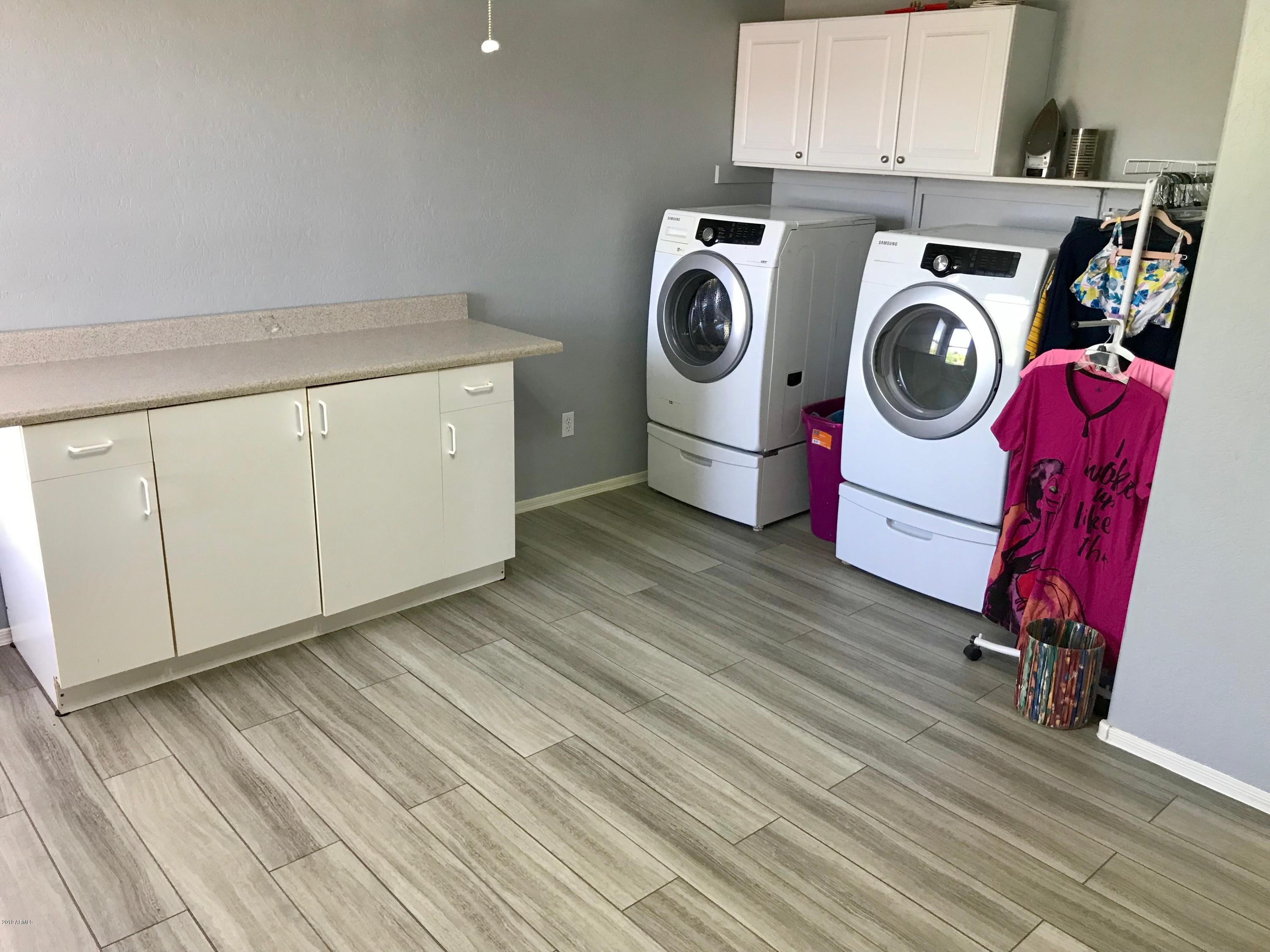 3136 West Redbird Road Phoenix, AZ 85083 - Photo 35 of 47 Spacious Laundry with cabinets