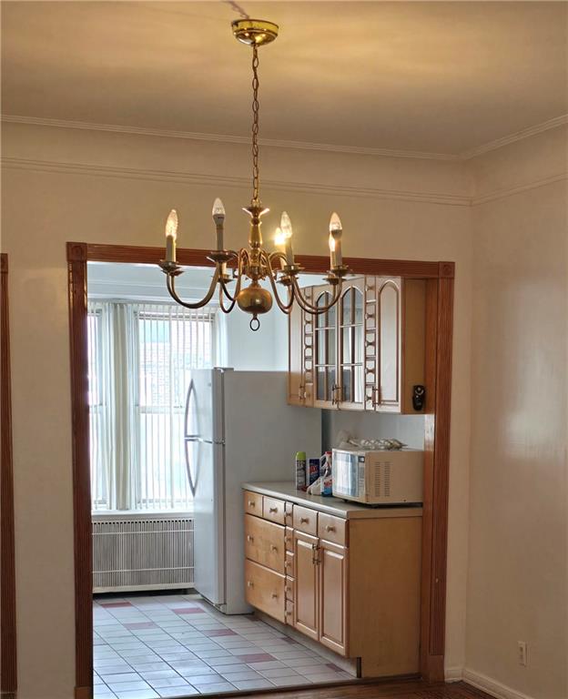 1202 East 38th Street Brooklyn, NY 11210 - Photo 6 of 11 a kitchen with stainless steel appliances granite countertop a sink a stove and a wooden floors