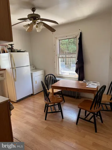a work room with furniture and a window