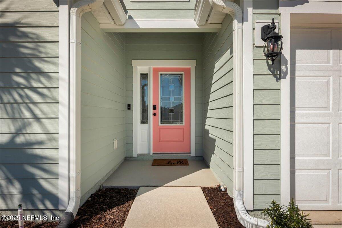 945 Rustlewood Lane St. Johns, FL 32259 - Photo 3 of 43 a front view of a house with a door