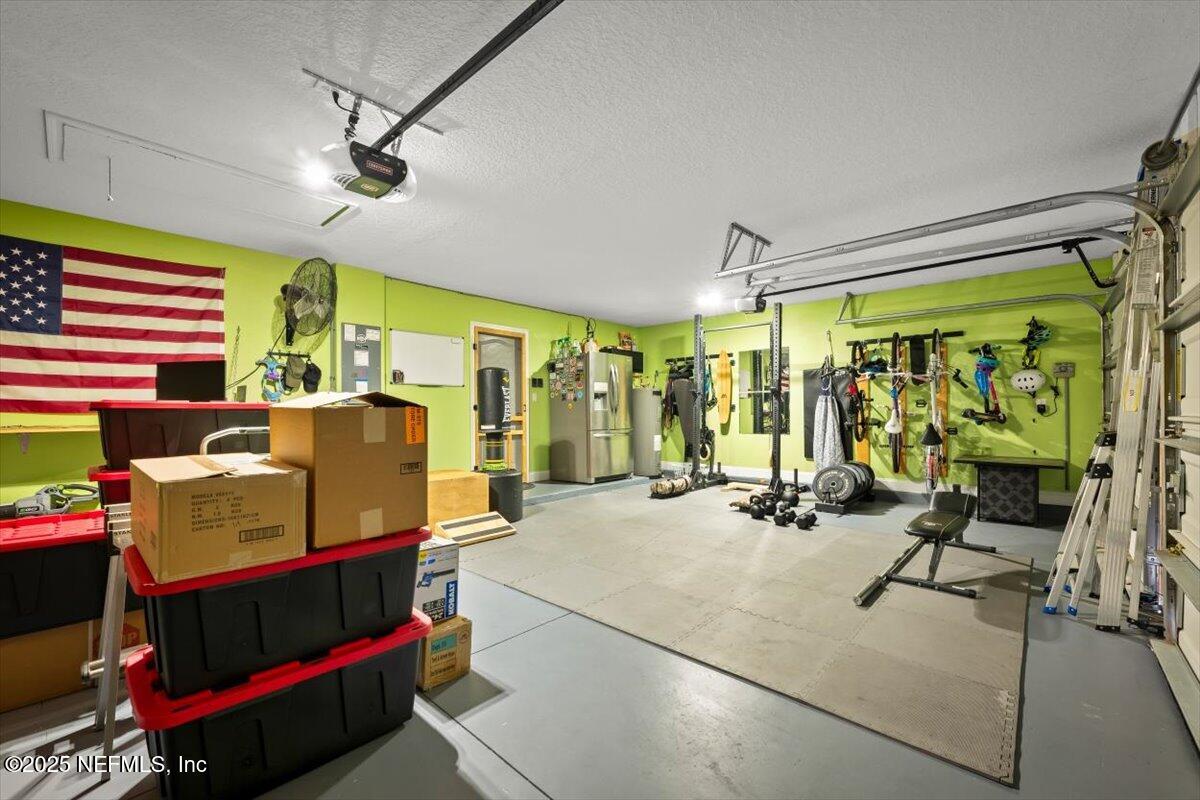 945 Rustlewood Lane St. Johns, FL 32259 - Photo 37 of 43 a room with gym equipment and a large window