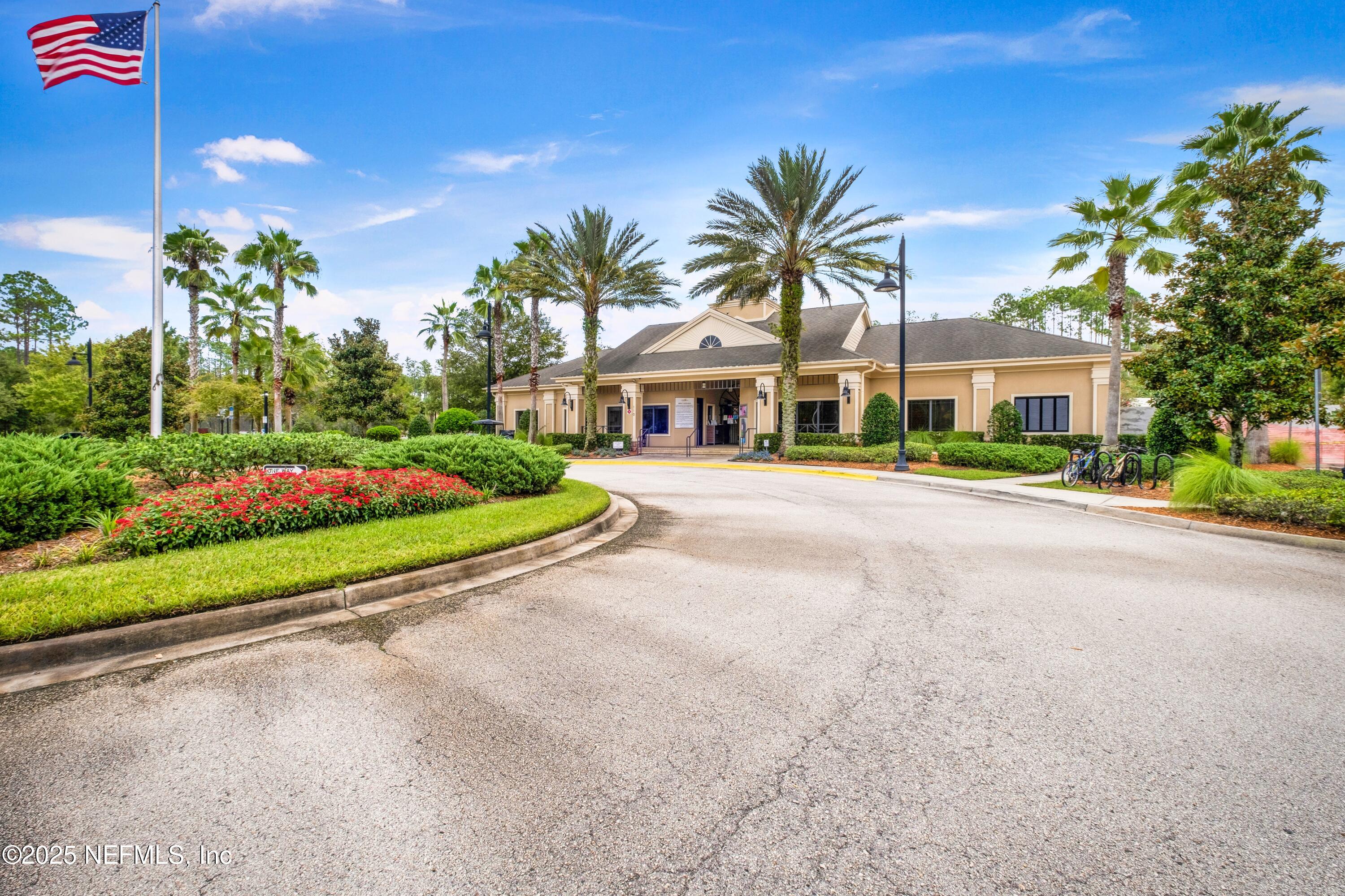 945 Rustlewood Lane St. Johns, FL 32259 - Photo 42 of 43 a front view of a house with a garden and yard