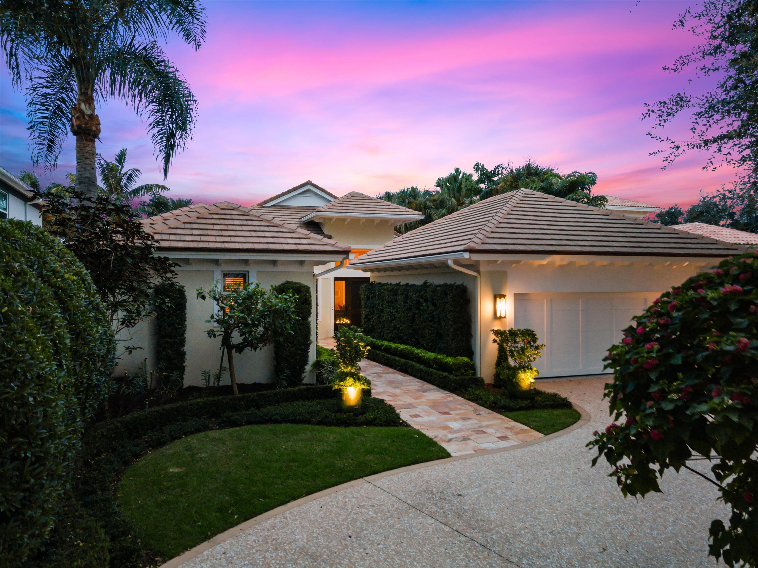 113 Echo Drive Jupiter, FL 33458 - Photo 1 of 15 a front view of a house with garden