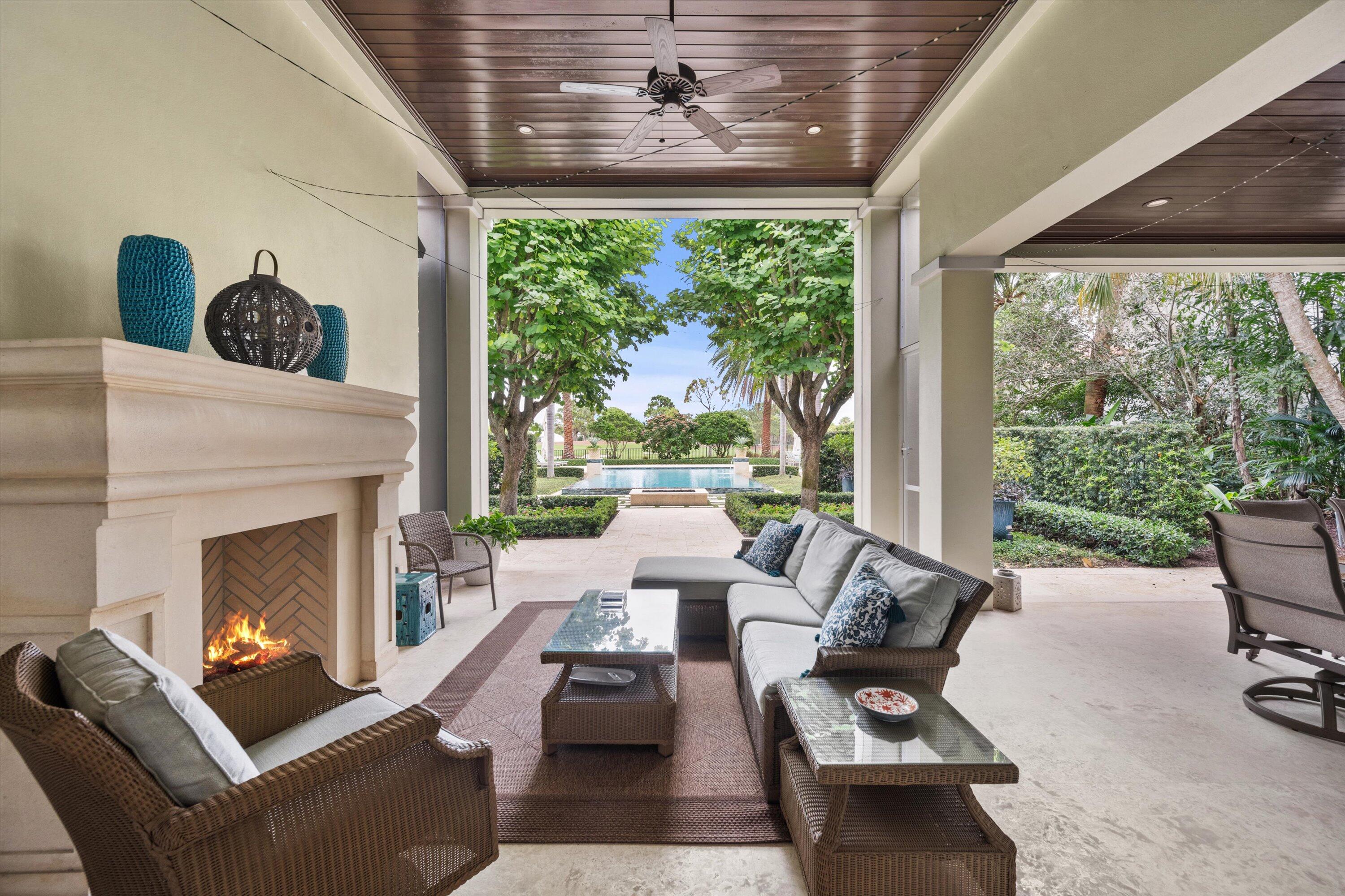 113 Echo Drive Jupiter, FL 33458 - Photo 11 of 15 a living room with furniture and a fireplace
