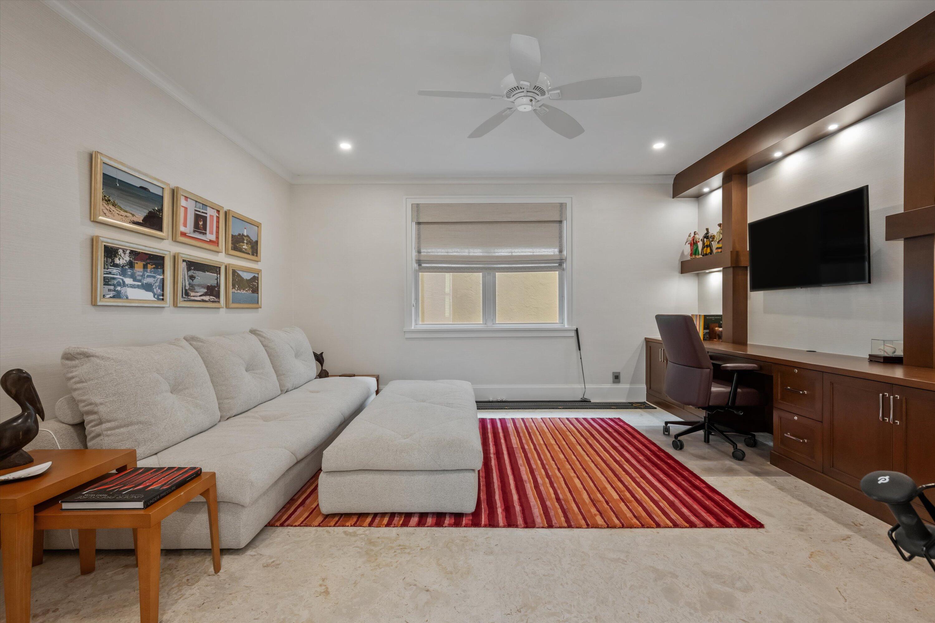 113 Echo Drive Jupiter, FL 33458 - Photo 10 of 15 a living room with furniture and a flat screen tv