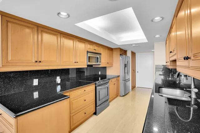a view of a balcony with chair and table