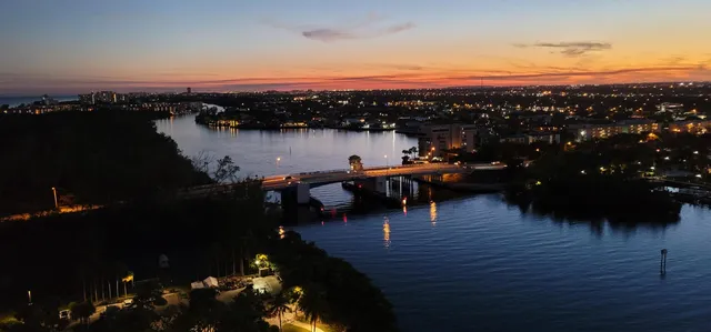 a living room with furniture a rug and a window