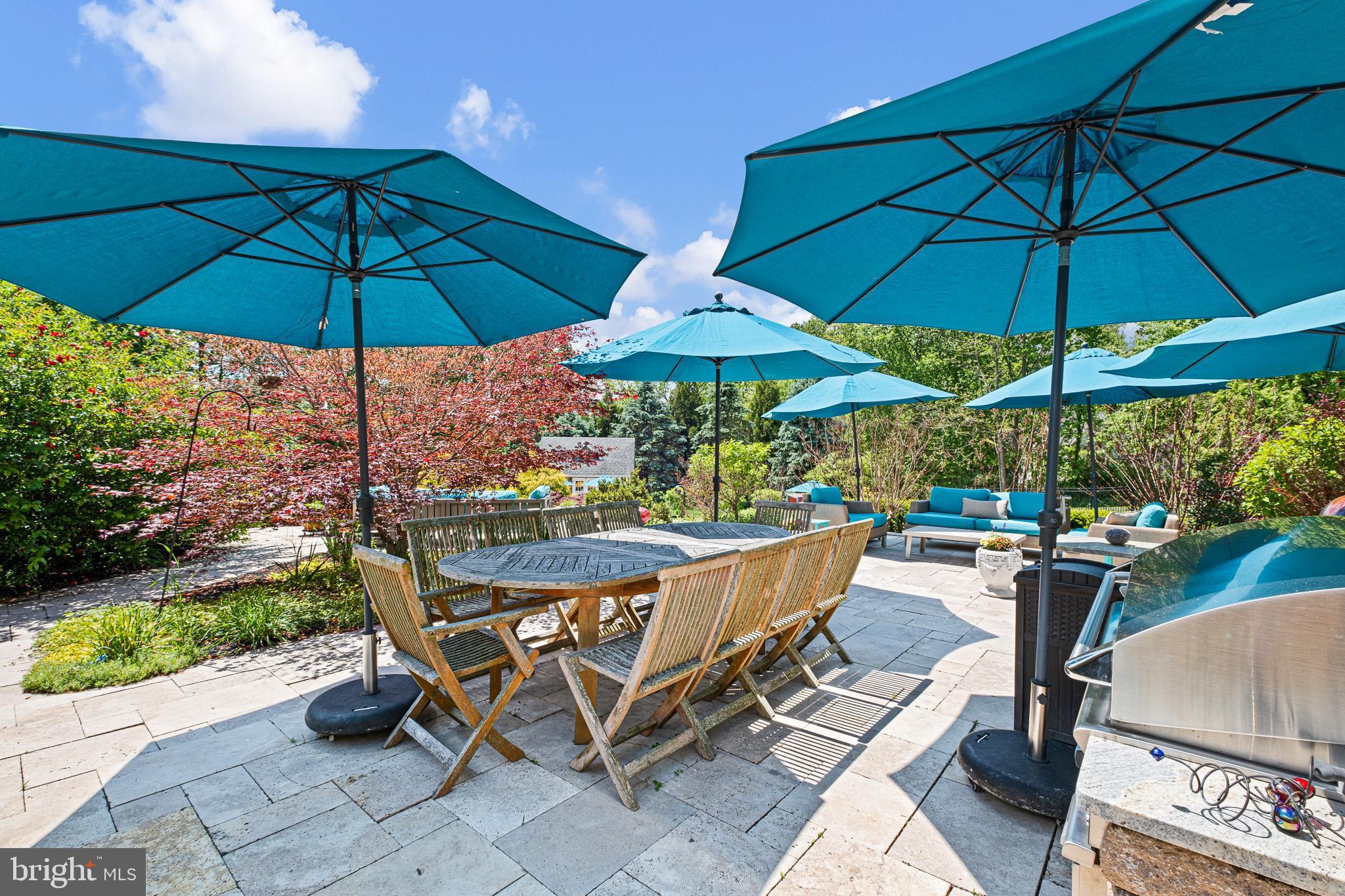 104 Indian Springs Road Kennett Square, PA 19348 - Photo 103 of 106 a view of a chairs and table under an umbrella