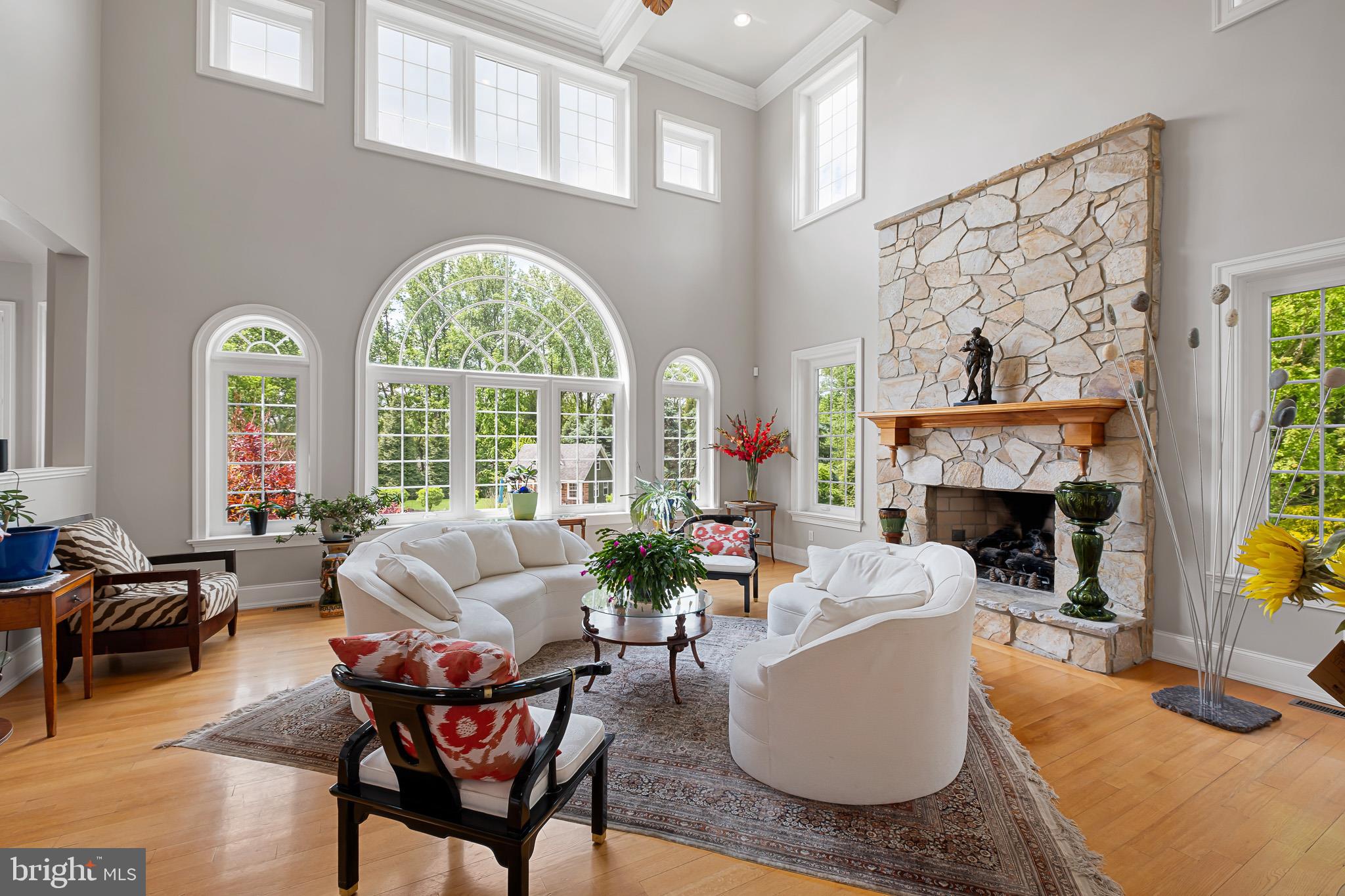 104 Indian Springs Road Kennett Square, PA 19348 - Photo 32 of 106 a living room with furniture a fireplace and a large window
