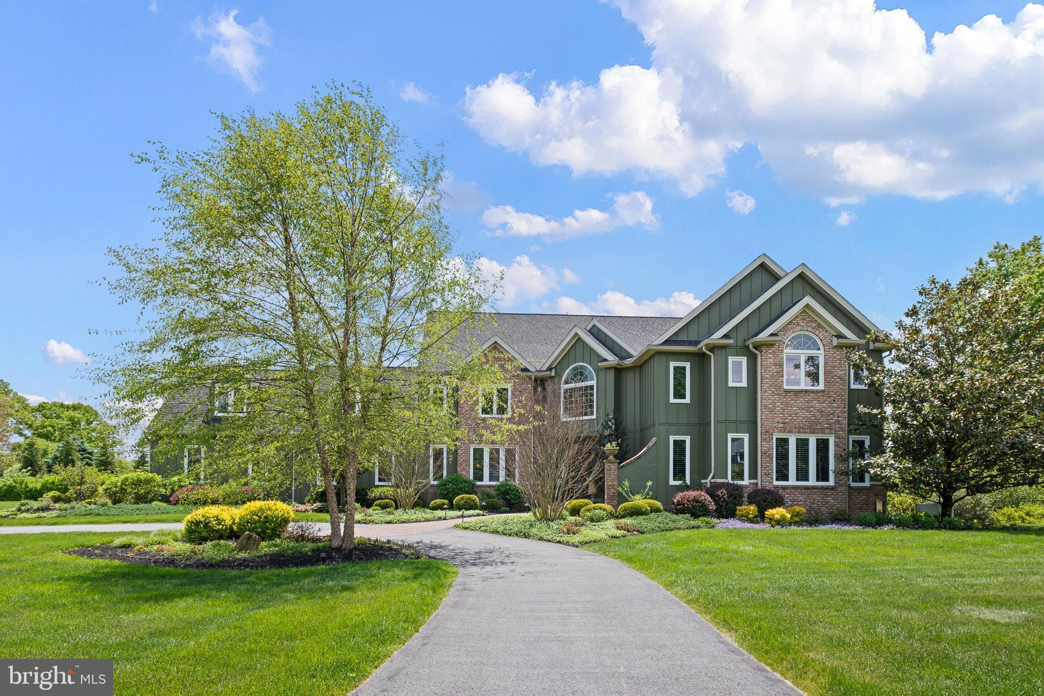 104 Indian Springs Road Kennett Square, PA 19348 - Photo 4 of 106 a front view of a house with a garden