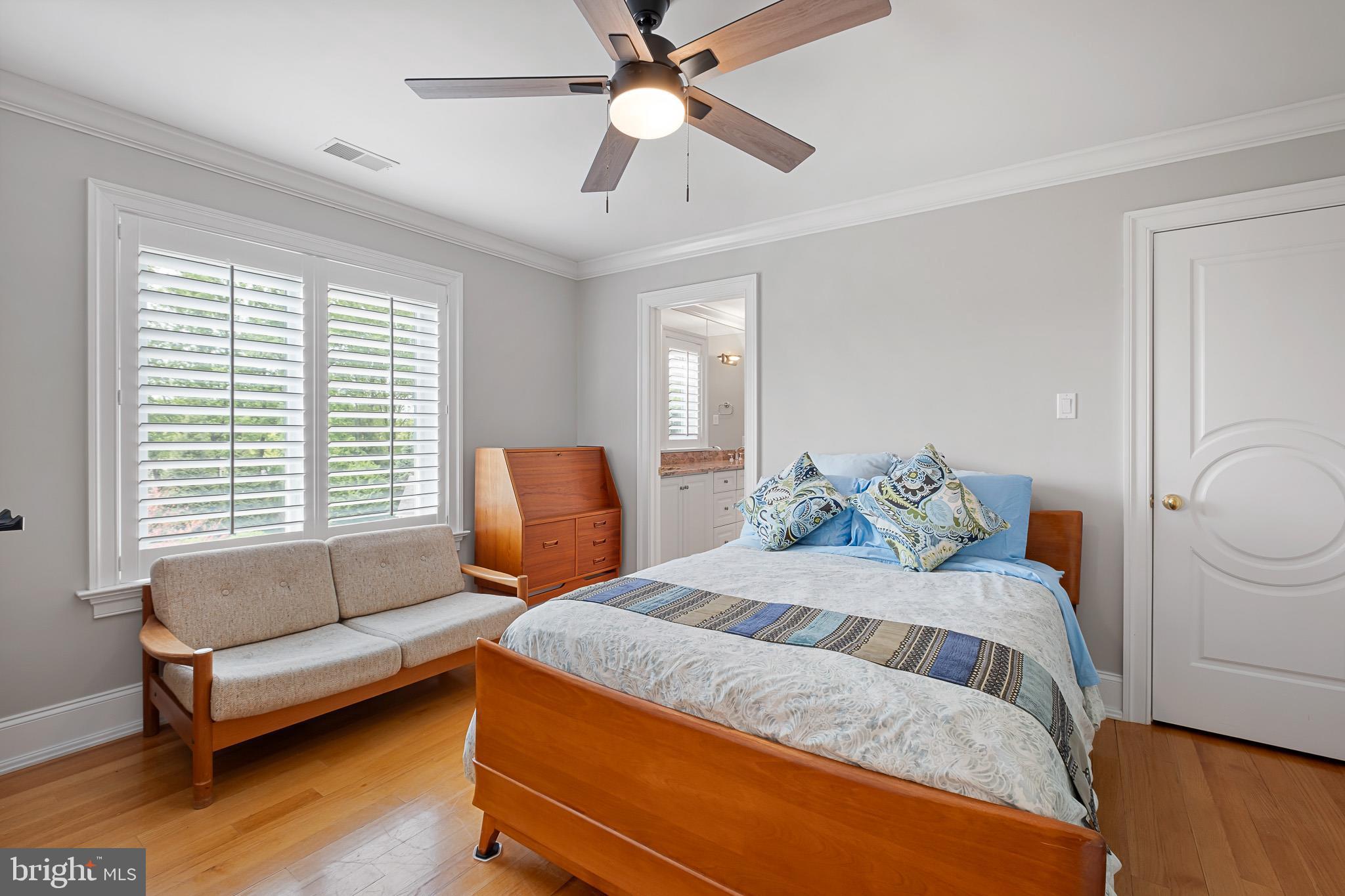 104 Indian Springs Road Kennett Square, PA 19348 - Photo 59 of 106 a bedroom with a bed and wooden floor