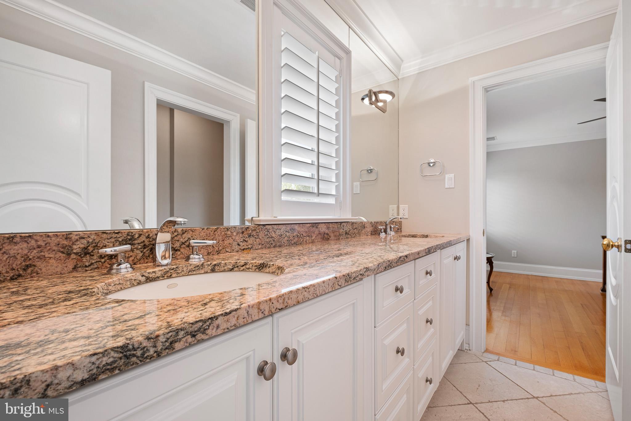 104 Indian Springs Road Kennett Square, PA 19348 - Photo 60 of 106 a bathroom with a granite countertop sink and a mirror