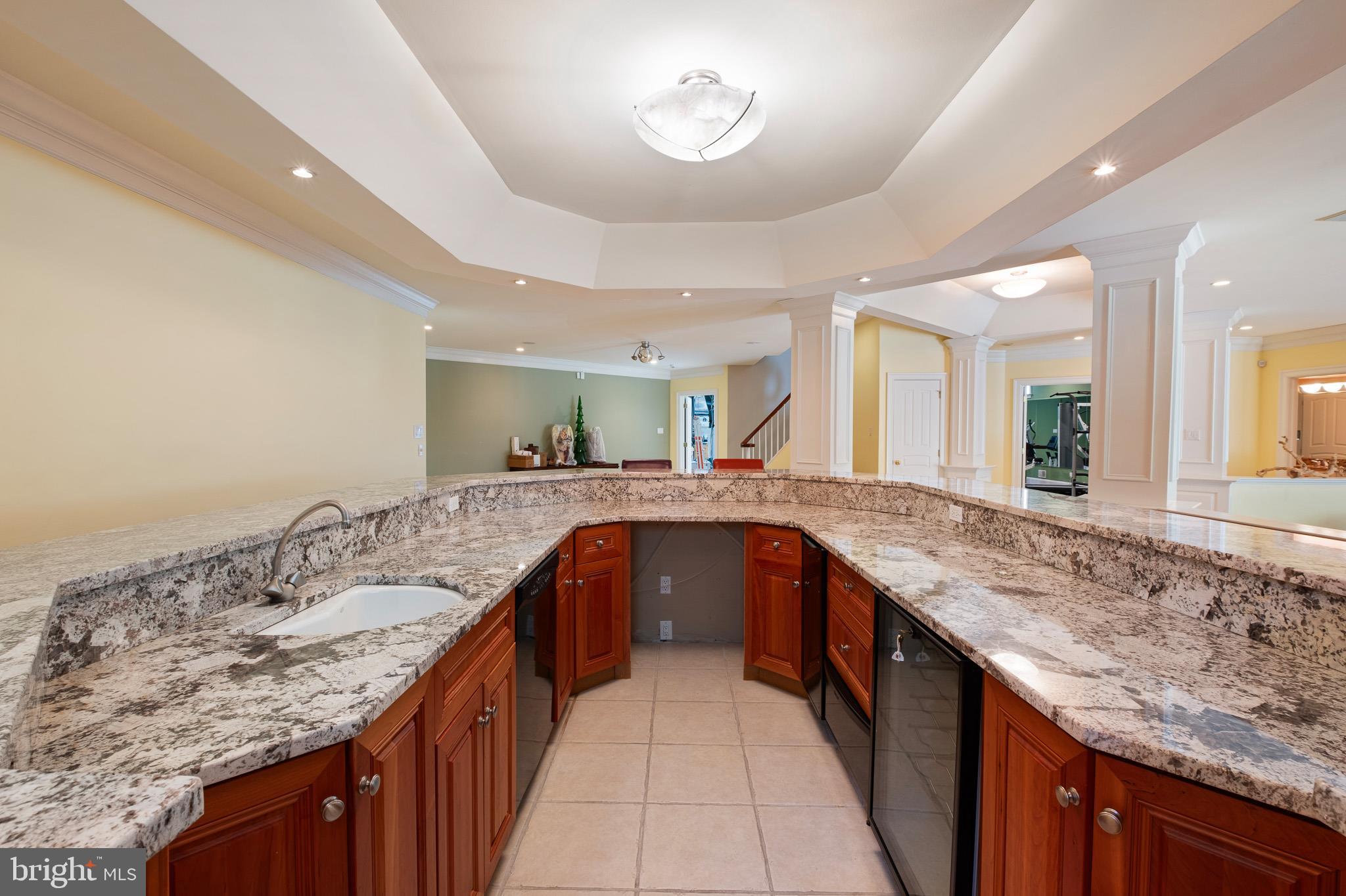 104 Indian Springs Road Kennett Square, PA 19348 - Photo 74 of 106 a kitchen with granite countertop kitchen island a sink appliances and a counter space