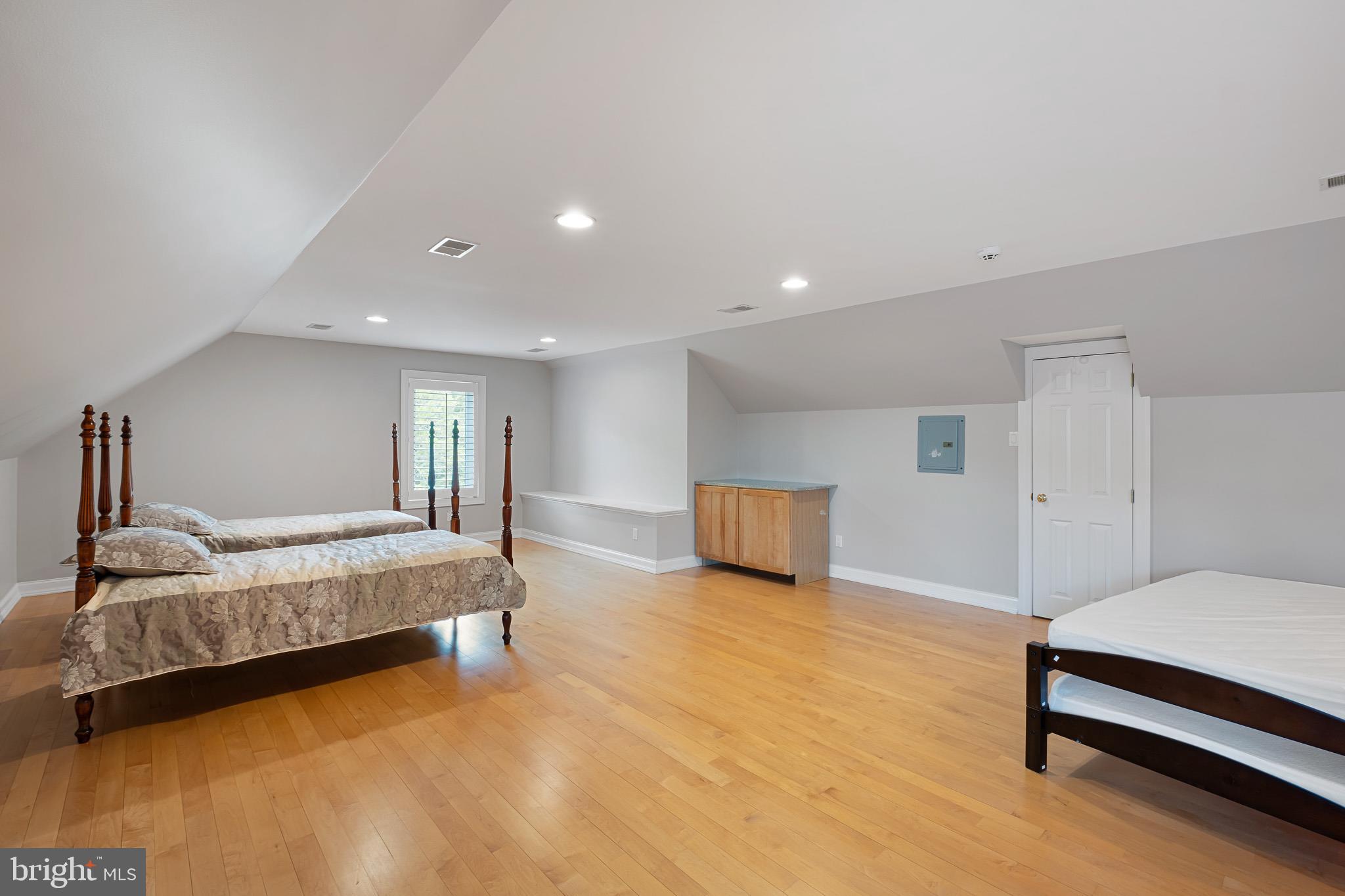 104 Indian Springs Road Kennett Square, PA 19348 - Photo 78 of 106 a spacious bedroom with a bed and a couch
