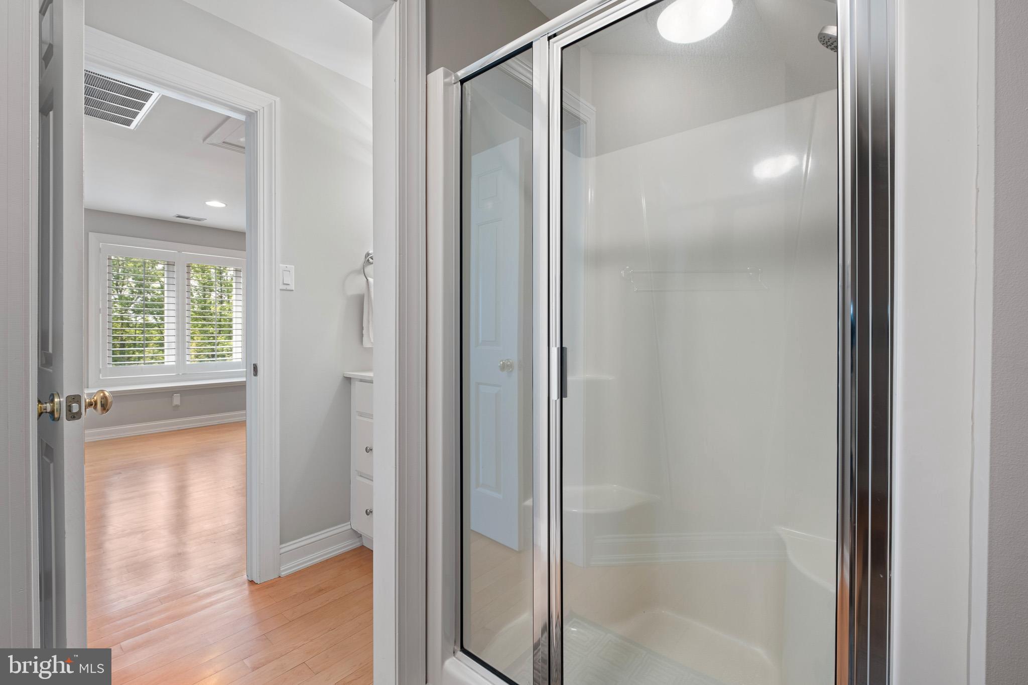 104 Indian Springs Road Kennett Square, PA 19348 - Photo 81 of 106 a bathroom with a glass shower door
