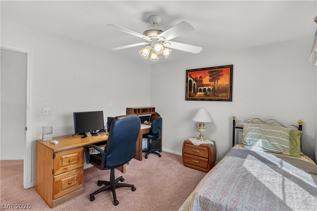 2055 Cholla Way Laughlin, NV 89029 - Photo 28 of 87 A versatile bedroom offering a comfortable sleeping area alongside a dedicated workspace.