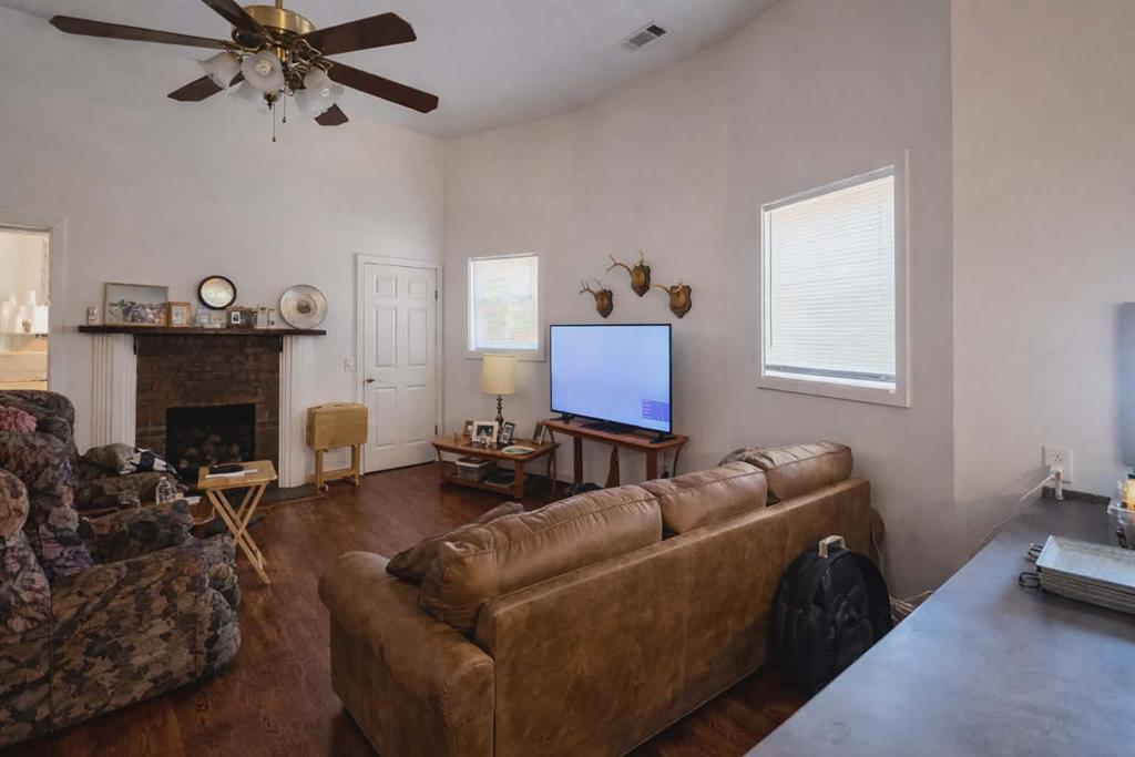 1504 Broad Street Lumpkin, GA 31815 - Photo 2 of 7 a living room with furniture and a fireplace