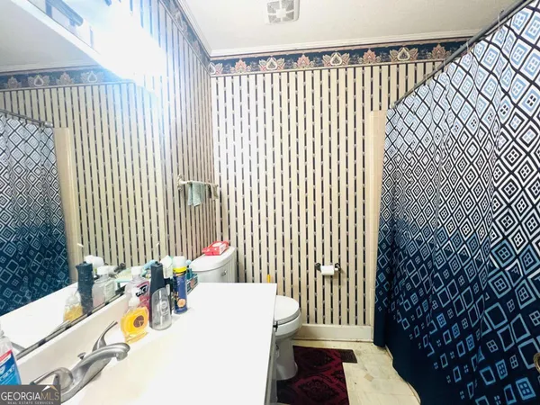 a living room with a couch next to a window