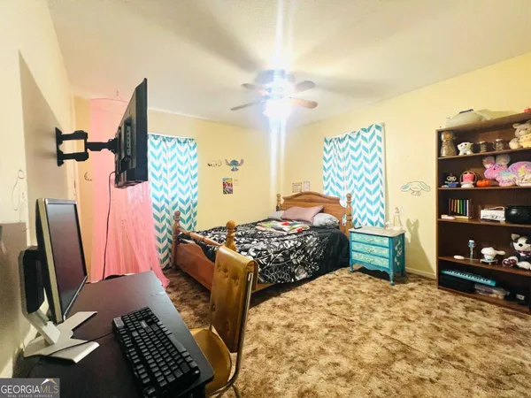 a bedroom with furniture and a bed