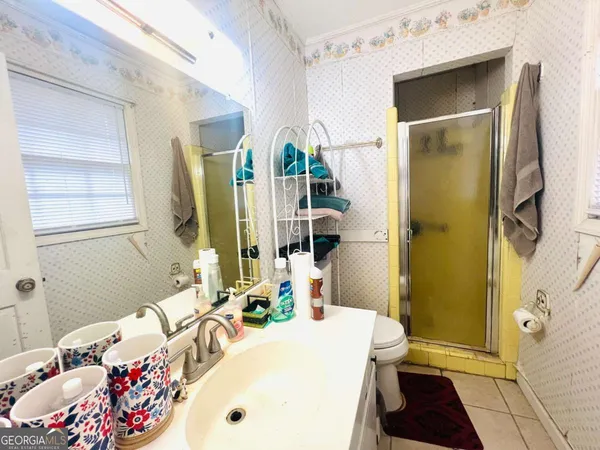 a bathroom with a tub sink and a mirror