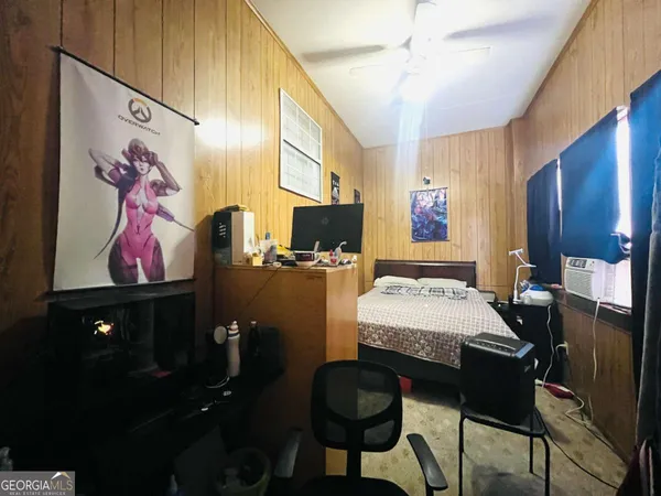 a room with furniture and flat screen tv