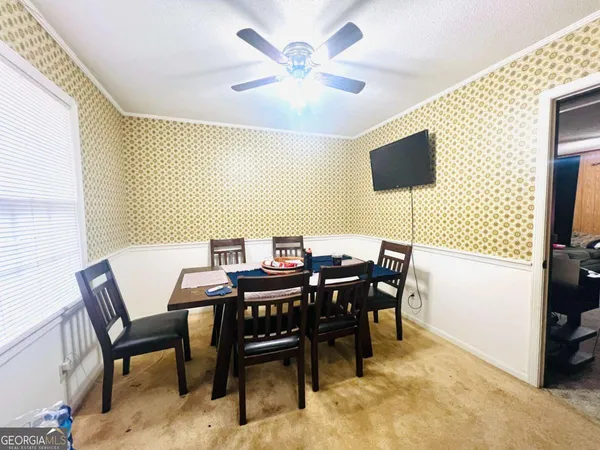 a view of a dining room with furniture